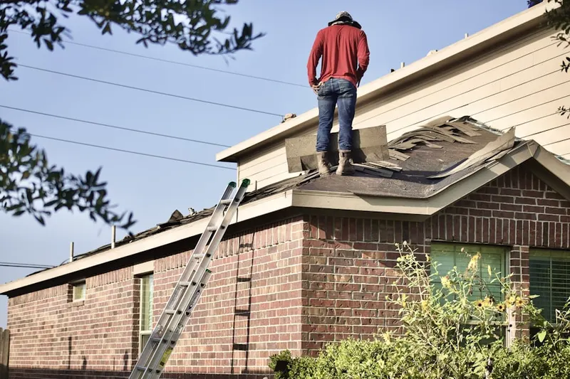 Professional roofer working on a residential roof in Tarzana